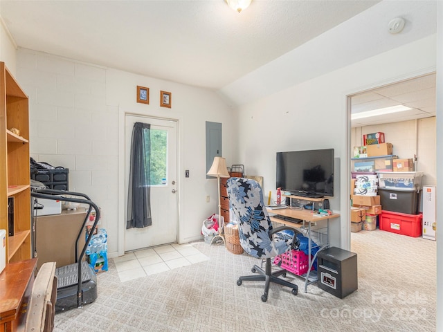 carpeted office featuring electric panel and vaulted ceiling