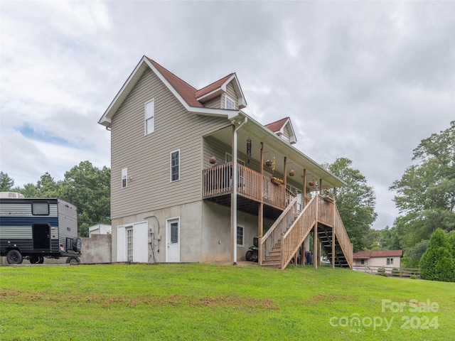 rear view of house with a yard