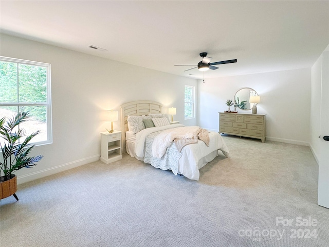 carpeted bedroom with ceiling fan