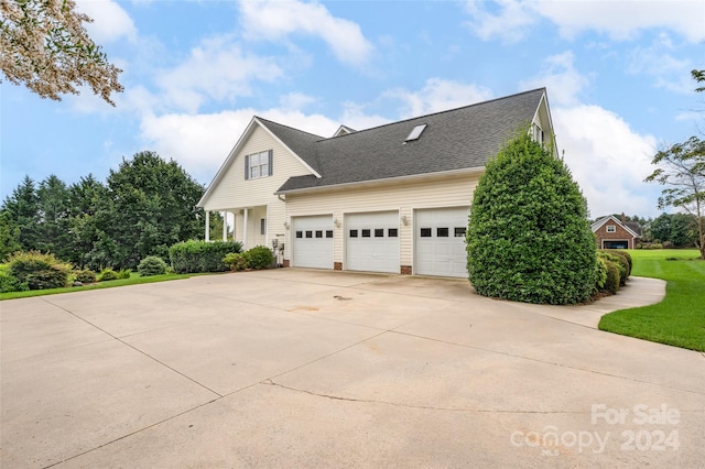 view of side of home featuring a garage