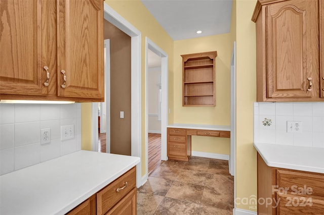 kitchen featuring backsplash and light hardwood / wood-style floors