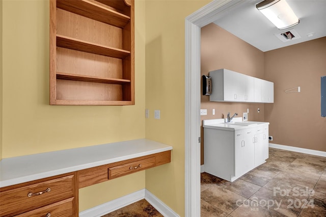 interior space with sink and light tile patterned floors