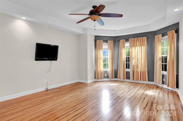 unfurnished room with ceiling fan and wood-type flooring