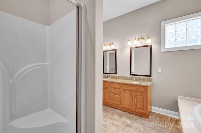 bathroom with tile patterned floors, plus walk in shower, and double sink vanity