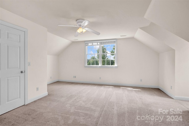 bonus room with lofted ceiling, ceiling fan, and light carpet