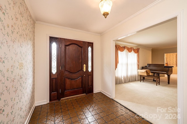 entryway featuring crown molding