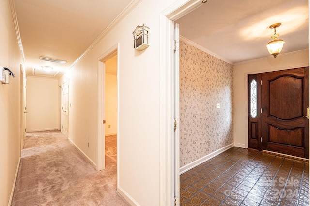 foyer entrance featuring crown molding