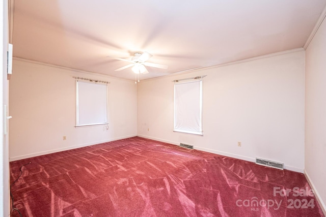 carpeted empty room with ornamental molding and ceiling fan