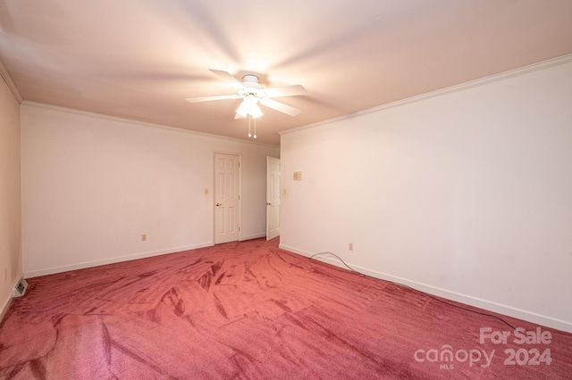 empty room featuring crown molding, ceiling fan, and carpet flooring