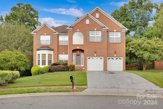 view of front facade with a front lawn and a garage