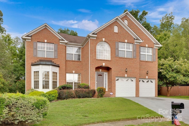 view of front facade featuring a garage and a front yard