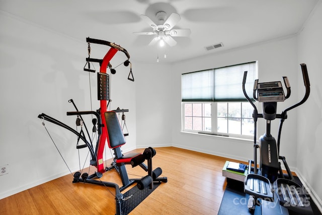 workout area with hardwood / wood-style flooring and ceiling fan