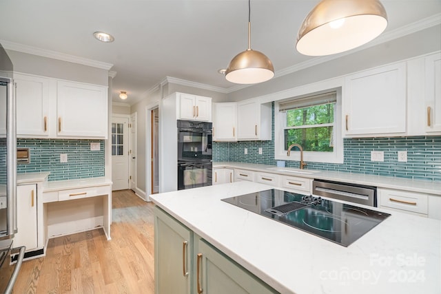 kitchen with backsplash, light wood-type flooring, sink, and dishwasher