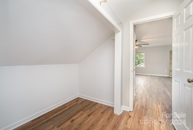 bonus room featuring ceiling fan, lofted ceiling, and wood-type flooring