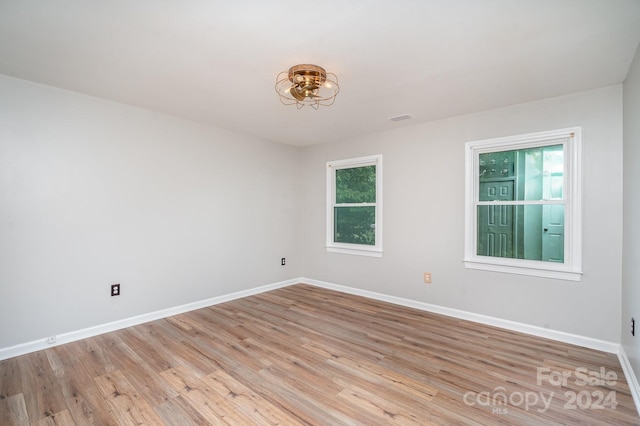 spare room featuring light hardwood / wood-style flooring