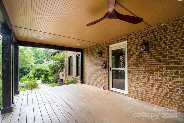 wooden terrace featuring ceiling fan