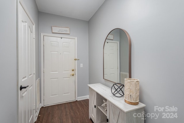 doorway with dark wood-type flooring