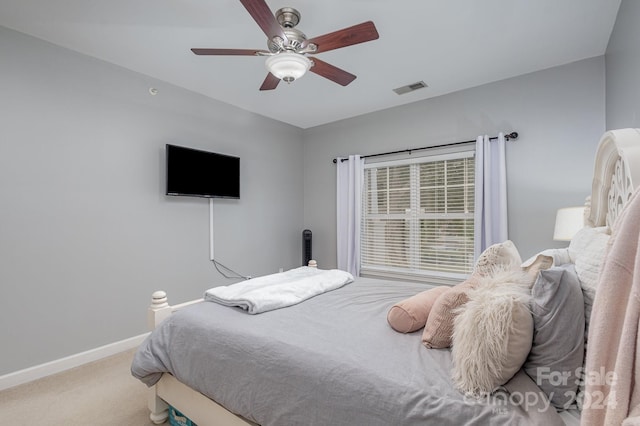 bedroom with a ceiling fan, carpet, visible vents, and baseboards
