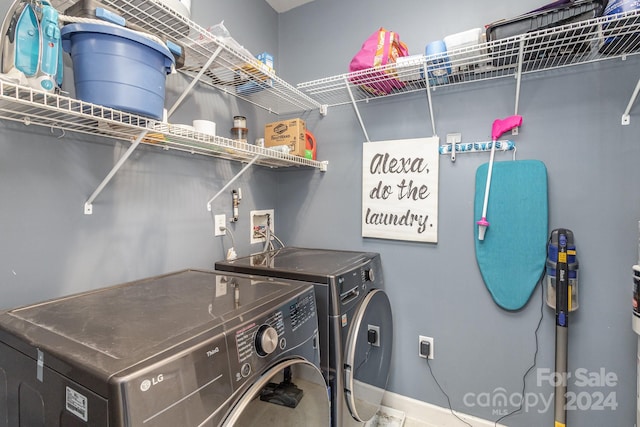 clothes washing area with laundry area and separate washer and dryer