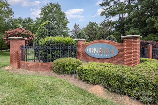 community sign with fence
