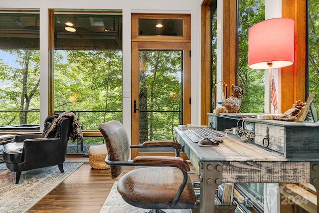 home office with hardwood / wood-style flooring