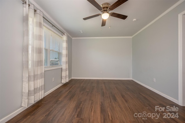 empty room featuring ceiling fan, crown molding, and dark hardwood / wood-style floors