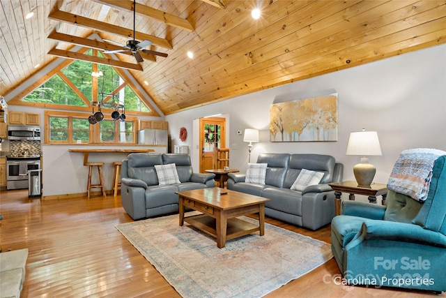 living room with beamed ceiling, light hardwood / wood-style flooring, wood ceiling, high vaulted ceiling, and ceiling fan