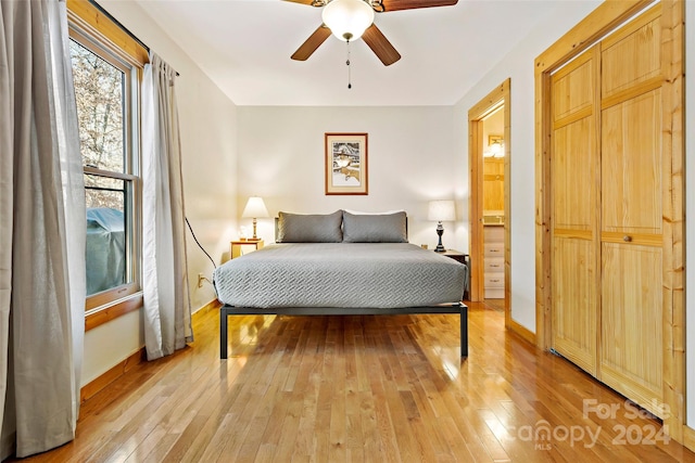 bedroom featuring light wood-type flooring and ceiling fan