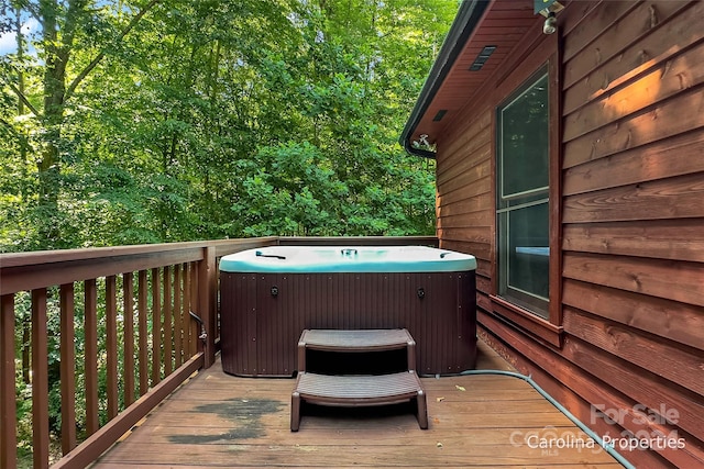 deck with a hot tub