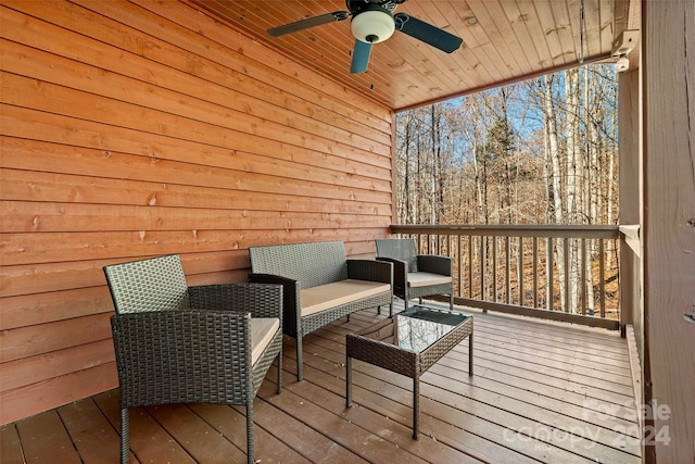 deck featuring ceiling fan and an outdoor hangout area