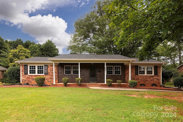 single story home featuring crawl space, brick siding, and a front yard