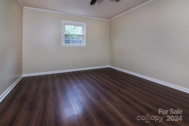 unfurnished room featuring ceiling fan, ornamental molding, dark wood finished floors, and baseboards