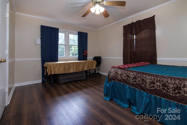 bedroom featuring baseboards, ceiling fan, wood finished floors, and crown molding