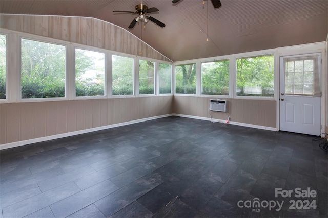 unfurnished sunroom featuring lofted ceiling, ceiling fan, and a wall mounted AC