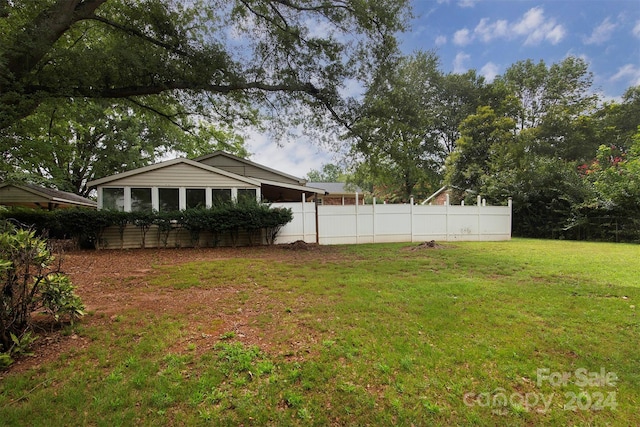 view of yard featuring fence