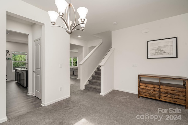 interior space with an inviting chandelier and wood-type flooring