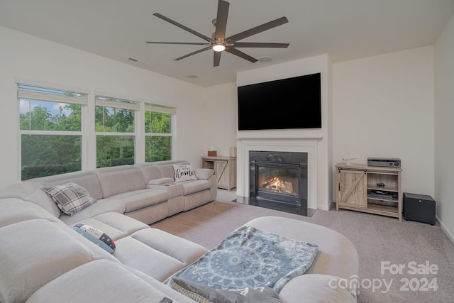 living room featuring carpet and ceiling fan