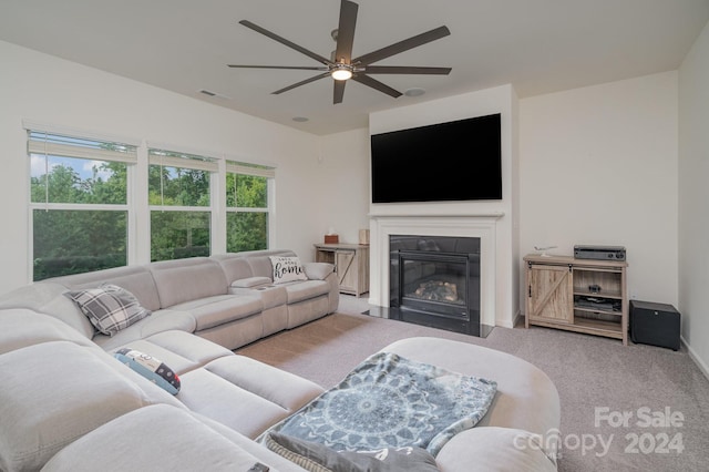 living room featuring ceiling fan and light colored carpet