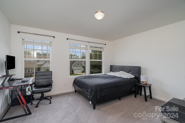 bedroom featuring light carpet