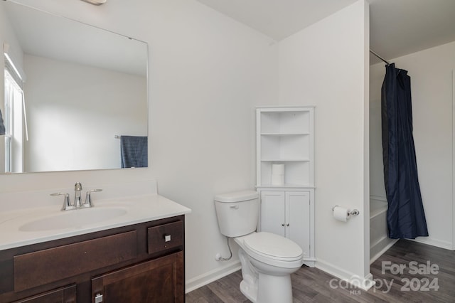 full bathroom featuring shower / tub combo, vanity, toilet, and hardwood / wood-style flooring