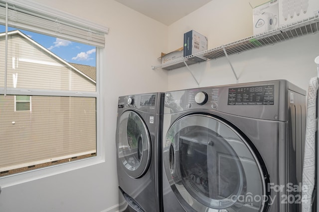 washroom with separate washer and dryer