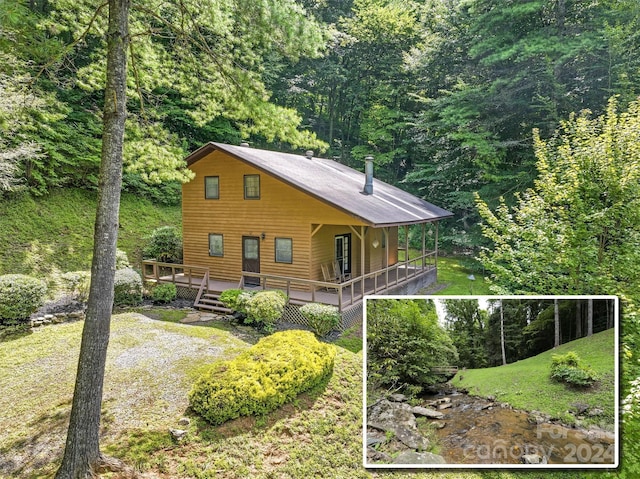 view of side of home with a deck