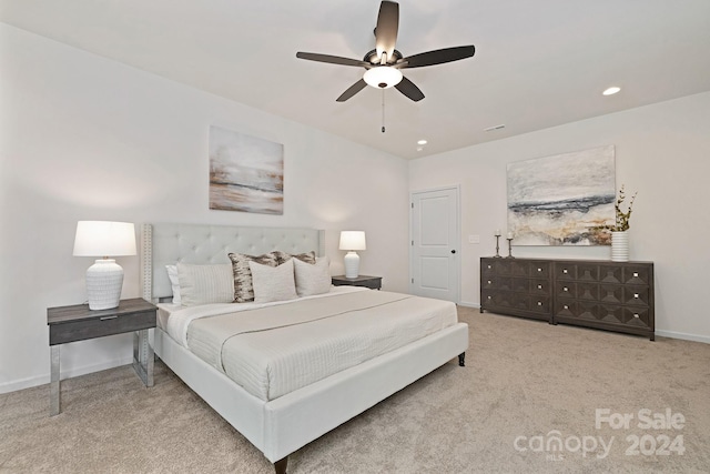 bedroom featuring ceiling fan and light colored carpet