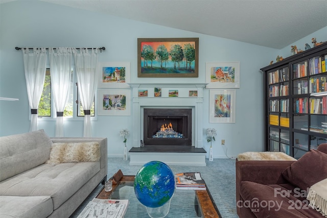 sitting room featuring baseboards, lofted ceiling, carpet, a lit fireplace, and a textured ceiling