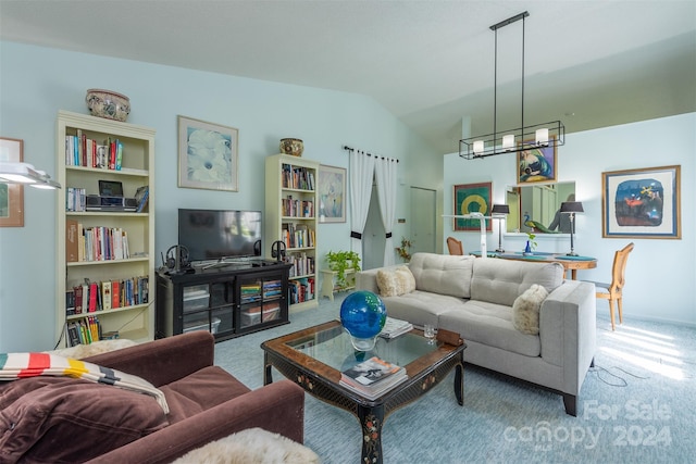 living area with vaulted ceiling, carpet floors, and an inviting chandelier