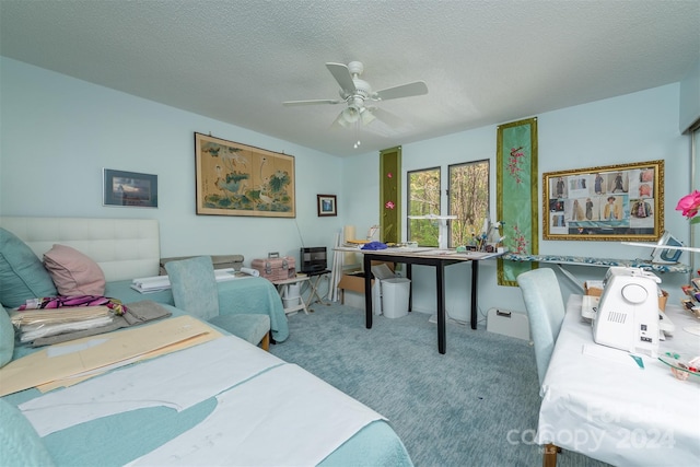 bedroom with carpet, a ceiling fan, and a textured ceiling