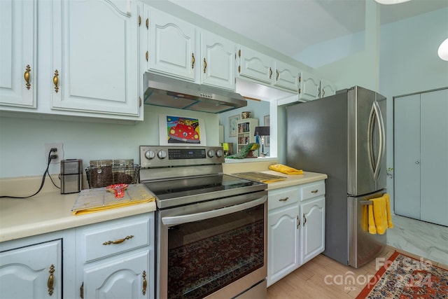 kitchen with stainless steel appliances, light countertops, white cabinetry, and under cabinet range hood