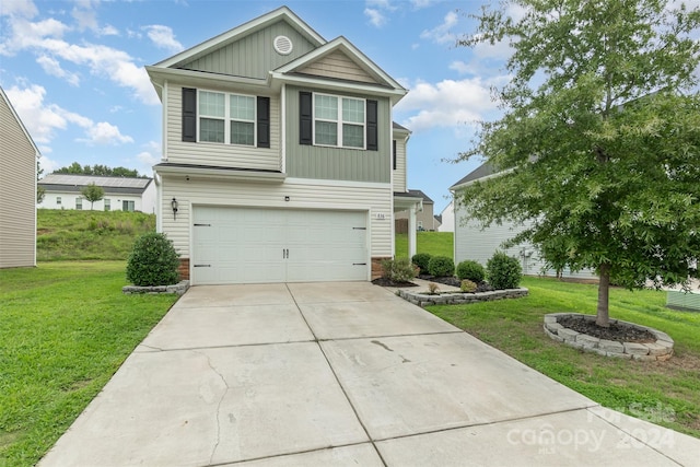 view of front facade with a garage and a front yard