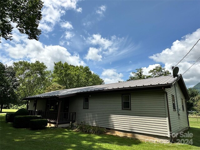 rear view of house with a yard