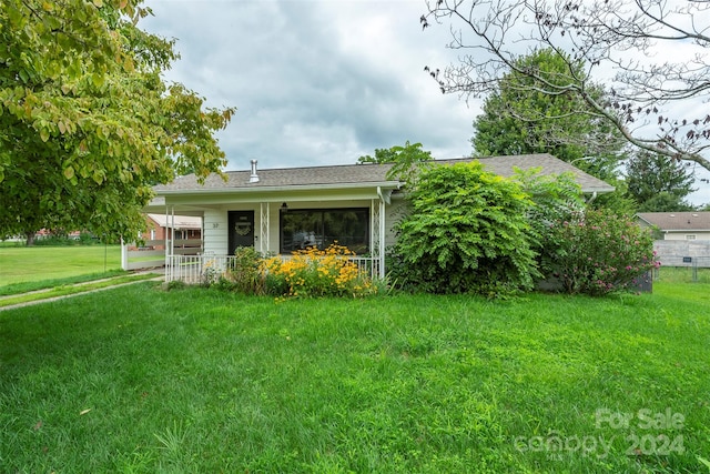 exterior space with a front yard and covered porch